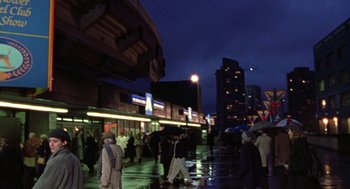 Movie still from “Best in Show” (2000), directed by Christopher Guest – A group of people walking down a street at night; Extreme Wide shot, Low angle