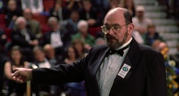 Movie still from “Best in Show” (2000), directed by Christopher Guest – An older man in a suit and bow tie; Medium shot, Low angle