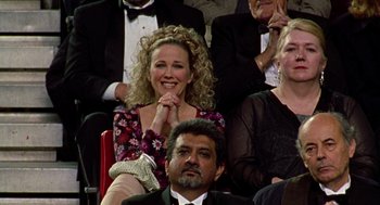 Movie still from “Best in Show” (2000), directed by Christopher Guest – A group of people sitting next to each other in a room; Medium shot, High angle