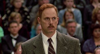 Movie still from “Best in Show” (2000), directed by Christopher Guest – A man with red hair and a mustache; Close Up shot, Low angle