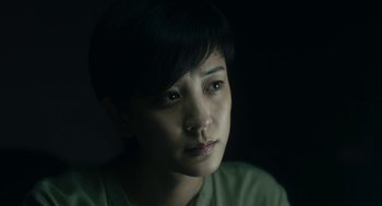 A person with short black hair