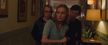 Movie still from “Better Watch Out” (2016), directed by Chris Peckover – A group of young people standing in a room; Medium shot, Over the shoulder angle