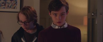 Movie still from “Better Watch Out” (2016), directed by Chris Peckover – A young boy standing in front of another young boy; Close Up shot, Over the shoulder angle