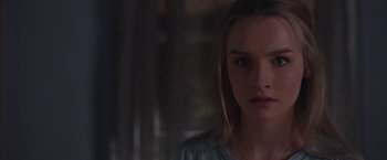Movie still from “Better Watch Out” (2016), directed by Chris Peckover – A person wearing a blue shirt; Close Up shot, Over the shoulder angle