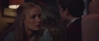 Movie still from “Better Watch Out” (2016), directed by Chris Peckover – A young woman and a young man talking to each other; Close Up shot, Over the shoulder angle