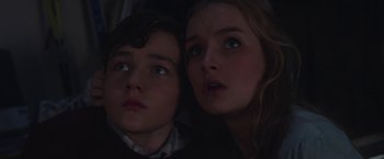 Movie still from “Better Watch Out” (2016), directed by Chris Peckover – Two young people are looking up at the sky; Close Up shot, Low angle