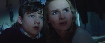 Movie still from “Better Watch Out” (2016), directed by Chris Peckover – Two young people looking up at the sky; Close Up shot, Low angle