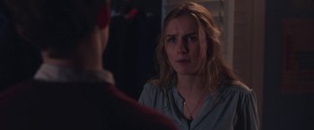 Movie still from “Better Watch Out” (2016), directed by Chris Peckover – A woman looking at a man in a mirror; Close Up shot, Over the shoulder angle