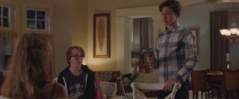 Movie still from “Better Watch Out” (2016), directed by Chris Peckover – Two young men are playing a video game; Medium shot, Over the shoulder angle