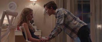 Movie still from “Better Watch Out” (2016), directed by Chris Peckover – A young man and a young woman holding hands; Medium shot, Over the shoulder angle