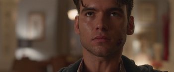 Movie still from “Better Watch Out” (2016), directed by Chris Peckover – Close up of a man's face in a dark room; Close Up shot, Low angle