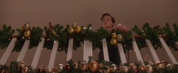 Movie still from “Better Watch Out” (2016), directed by Chris Peckover – A man standing in front of a christmas tree; Medium shot, Low angle