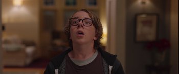 Movie still from “Better Watch Out” (2016), directed by Chris Peckover – A man with glasses is looking up at the ceiling; Close Up shot, Low angle