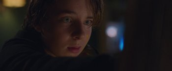 Movie still from “Better Watch Out” (2016), directed by Chris Peckover – A person looking at the camera; Close Up shot, Low angle