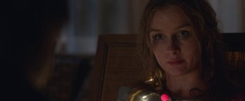 Movie still from “Better Watch Out” (2016), directed by Chris Peckover – A woman with a red light in her mouth; Close Up shot, Low angle