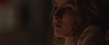 Movie still from “Better Watch Out” (2016), directed by Chris Peckover – A person with blood on her face; Extreme Close Up shot, Low angle