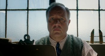 Movie still from “Big Eyes” (2014), directed by Tim Burton – A man looking at himself in a mirror; Close Up shot, Low angle