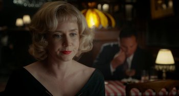 Movie still from “Big Eyes” (2014), directed by Tim Burton – A woman sitting at a table in front of a man; Close Up shot, Over the shoulder angle