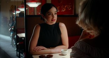 Movie still from “Big Eyes” (2014), directed by Tim Burton – A woman sitting at a table with a cup of coffee; Close Up shot, Over the shoulder angle