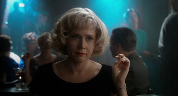 Movie still from “Big Eyes” (2014), directed by Tim Burton – A woman with blonde hair is smoking a cigarette; Close Up shot, Over the shoulder angle