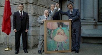 Movie still from “Big Eyes” (2014), directed by Tim Burton – A group of men standing next to a painting; Medium shot, Over the shoulder angle