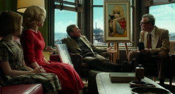 Movie still from “Big Eyes” (2014), directed by Tim Burton – A man and a woman sitting in front of a painting; Wide shot, Over the shoulder angle