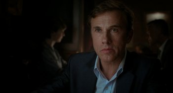 Movie still from “Big Eyes” (2014), directed by Tim Burton – A person wearing a suit and tie; Close Up shot, Over the shoulder angle