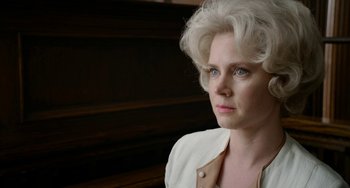 Movie still from “Big Eyes” (2014), directed by Tim Burton – A person wearing a white shirt; Close Up shot, Low angle