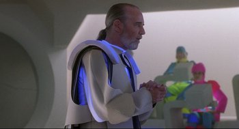 Movie still from “Bill & Ted's Bogus Journey” (1991), directed by Peter Hewitt – A man with long white hair and a long beard; Medium shot, Over the shoulder angle