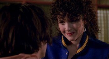 Movie still from “Bill & Ted's Bogus Journey” (1991), directed by Peter Hewitt – A person with curly hair; Close Up shot, Over the shoulder angle