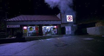 Movie still from “Bill & Ted's Bogus Journey” (1991), directed by Peter Hewitt – Smoke billows out of a store front at night; Extreme Wide shot, Low angle