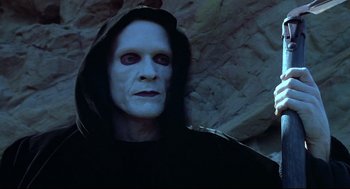 Movie still from “Bill & Ted's Bogus Journey” (1991), directed by Peter Hewitt – A man in a black robe and a black mask; Close Up shot, High angle