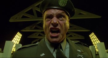 Movie still from “Bill & Ted's Bogus Journey” (1991), directed by Peter Hewitt – A man in a military uniform is yelling at the camera; Close Up shot, Low angle