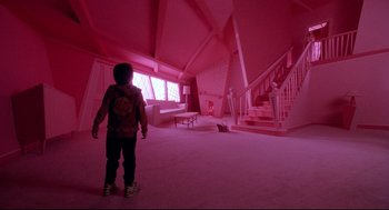 Movie still from “Bill & Ted's Bogus Journey” (1991), directed by Peter Hewitt – A person standing in a room with a cat on the floor; Wide shot, High angle