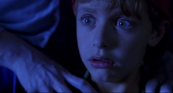 Movie still from “Bill & Ted's Bogus Journey” (1991), directed by Peter Hewitt – A child's face in the dark; Close Up shot, Over the shoulder angle