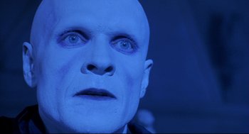 Movie still from “Bill & Ted's Bogus Journey” (1991), directed by Peter Hewitt – A man's face in blue light; Close Up shot, Low angle