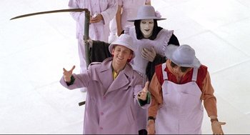 Movie still from “Bill & Ted's Bogus Journey” (1991), directed by Peter Hewitt – A group of people dressed up in costumes; Medium shot, Low angle