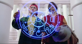 Movie still from “Bill & Ted's Bogus Journey” (1991), directed by Peter Hewitt – Two young men standing next to each other in front of a building; Medium shot, Low angle
