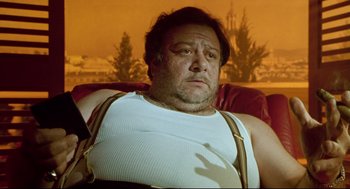 Movie still from “Bill & Ted's Bogus Journey” (1991), directed by Peter Hewitt – A person sitting on a couch; Medium shot, Low angle