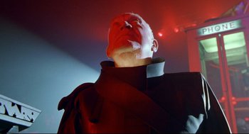 Movie still from “Bill & Ted's Bogus Journey” (1991), directed by Peter Hewitt – A man in a black jacket is looking up at the ceiling; Close Up shot, Low angle