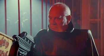 Movie still from “Bill & Ted's Bogus Journey” (1991), directed by Peter Hewitt – An older man is holding a remote control; Medium shot, Low angle