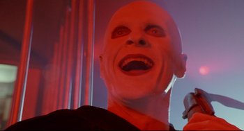Movie still from “Bill & Ted's Bogus Journey” (1991), directed by Peter Hewitt – The face of a man with a bald head; Close Up shot, Low angle