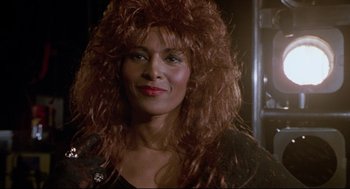 Movie still from “Bill & Ted's Bogus Journey” (1991), directed by Peter Hewitt – A person wearing a wig; Close Up shot, Low angle