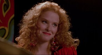 Movie still from “Bill & Ted's Bogus Journey” (1991), directed by Peter Hewitt – A person with curly red hair; Close Up shot, Over the shoulder angle