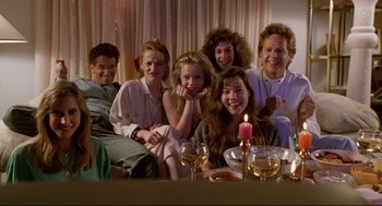 Movie still from “Bill & Ted's Bogus Journey” (1991), directed by Peter Hewitt – A group of people sitting around a dinner table; Medium shot, High angle