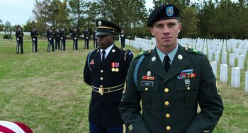 Movie still from “Billy Lynn's Long Halftime Walk” (2016), directed by Ang Lee – Two men in military uniforms standing in a field; Medium shot, Low angle