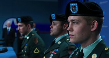 Movie still from “Billy Lynn's Long Halftime Walk” (2016), directed by Ang Lee – A group of men in military fatigues are standing in a row; Close Up shot, Low angle