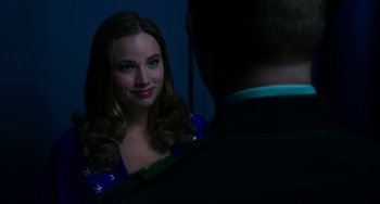 Movie still from “Billy Lynn's Long Halftime Walk” (2016), directed by Ang Lee – A woman in a blue dress looking at a man in a black suit; Close Up shot, Over the shoulder angle