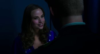 Movie still from “Billy Lynn's Long Halftime Walk” (2016), directed by Ang Lee – A woman in a blue dress is looking at a man in a black suit; Close Up shot, Over the shoulder angle