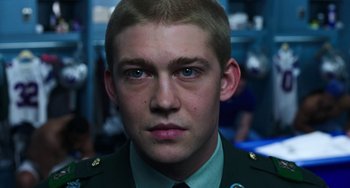 Movie still from “Billy Lynn's Long Halftime Walk” (2016), directed by Ang Lee – A person wearing a military uniform; Close Up shot, Over the shoulder angle